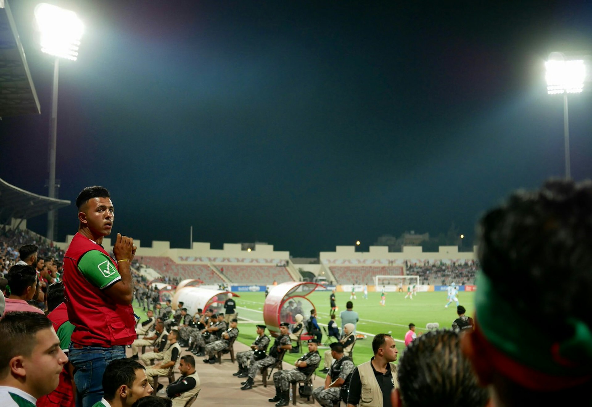 Wehdat fan watches a football match against Al Faisaly near Amman, Jordan