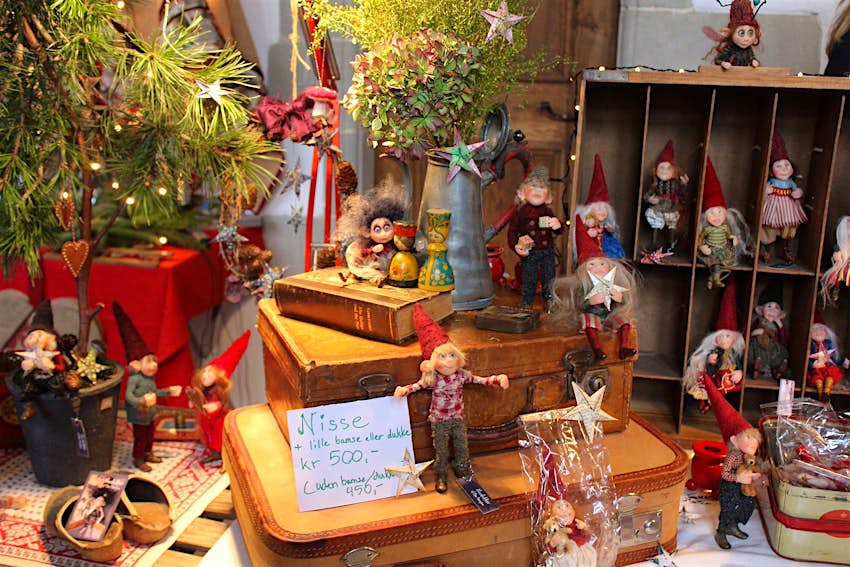 A display of handicrafts including wooden figures with woollen clothes for sale at a Christmas market in Copenhagen © Caroline Hadamitzky / Lonely Planet