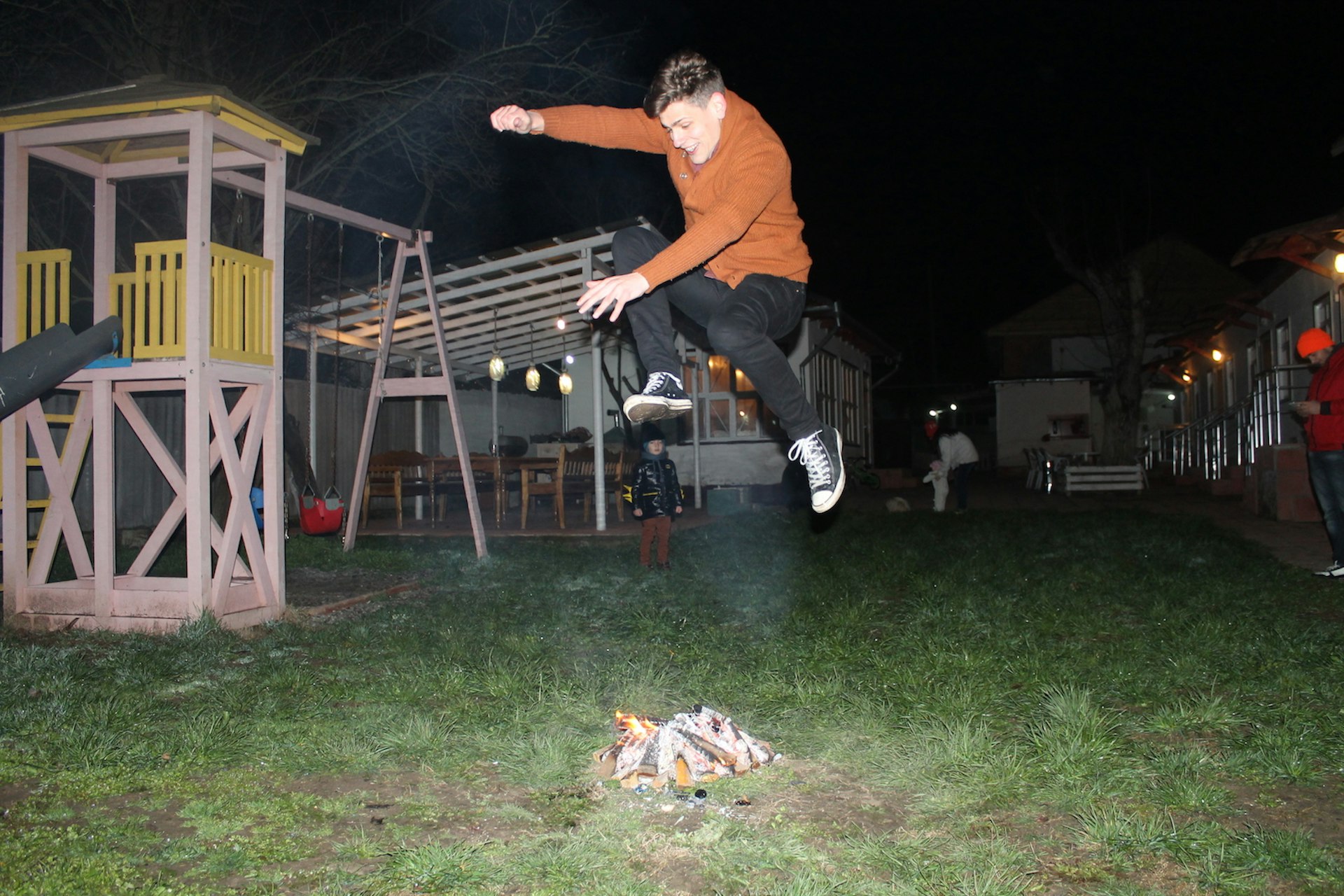 Jack Palfrey jumps a bonfire