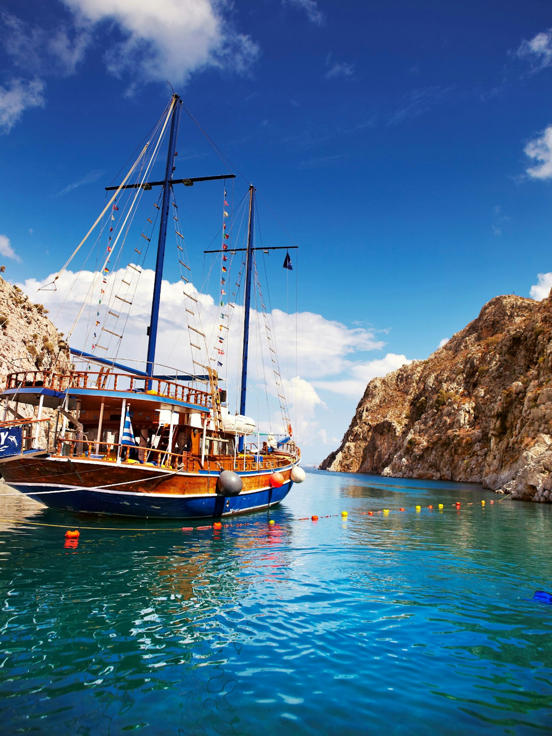 Yacht moored in a secluded cove on Kalymnos island, Greece