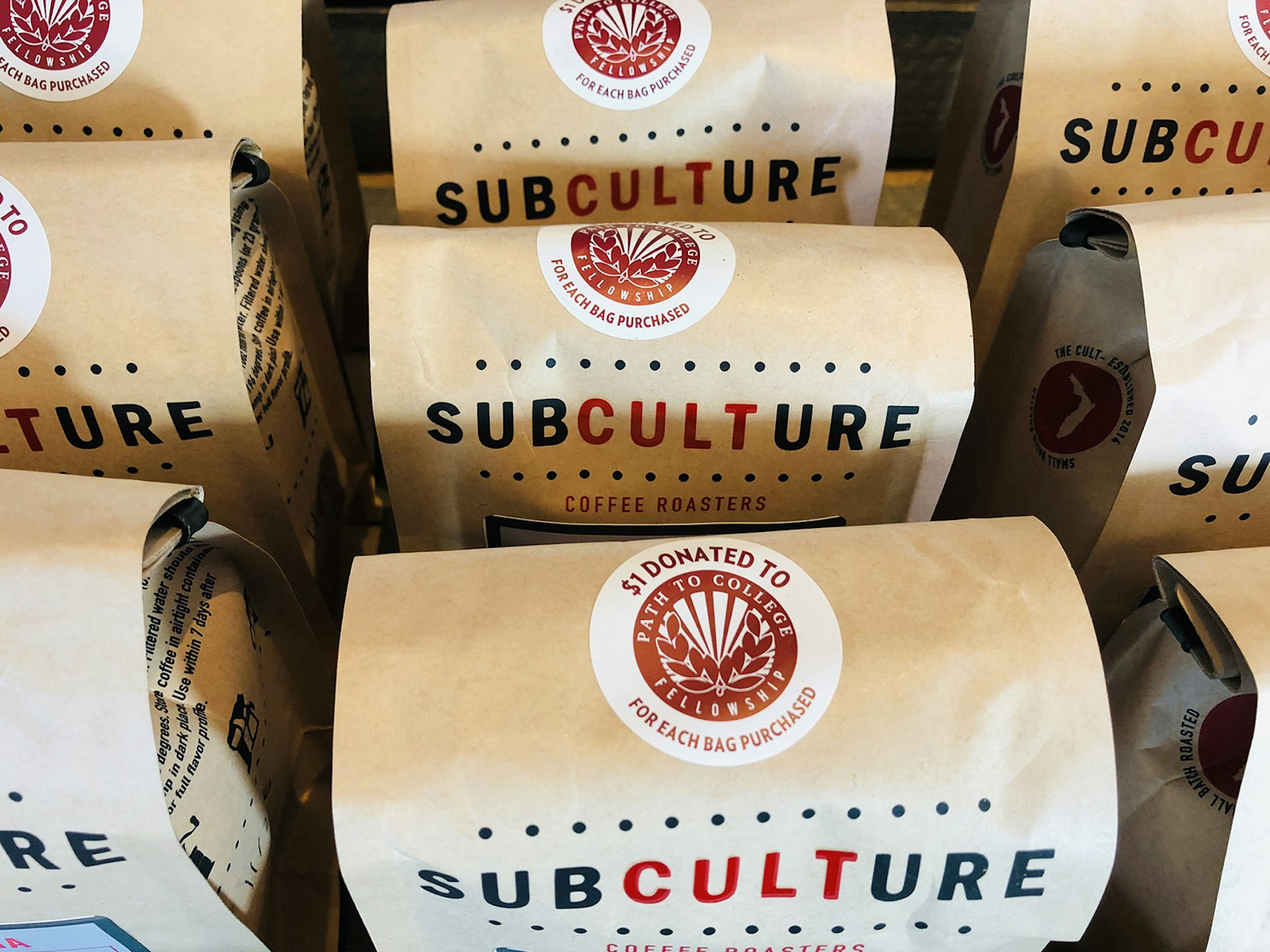 A lineup of brown bags of roasted coffee labled 'Subculture' 