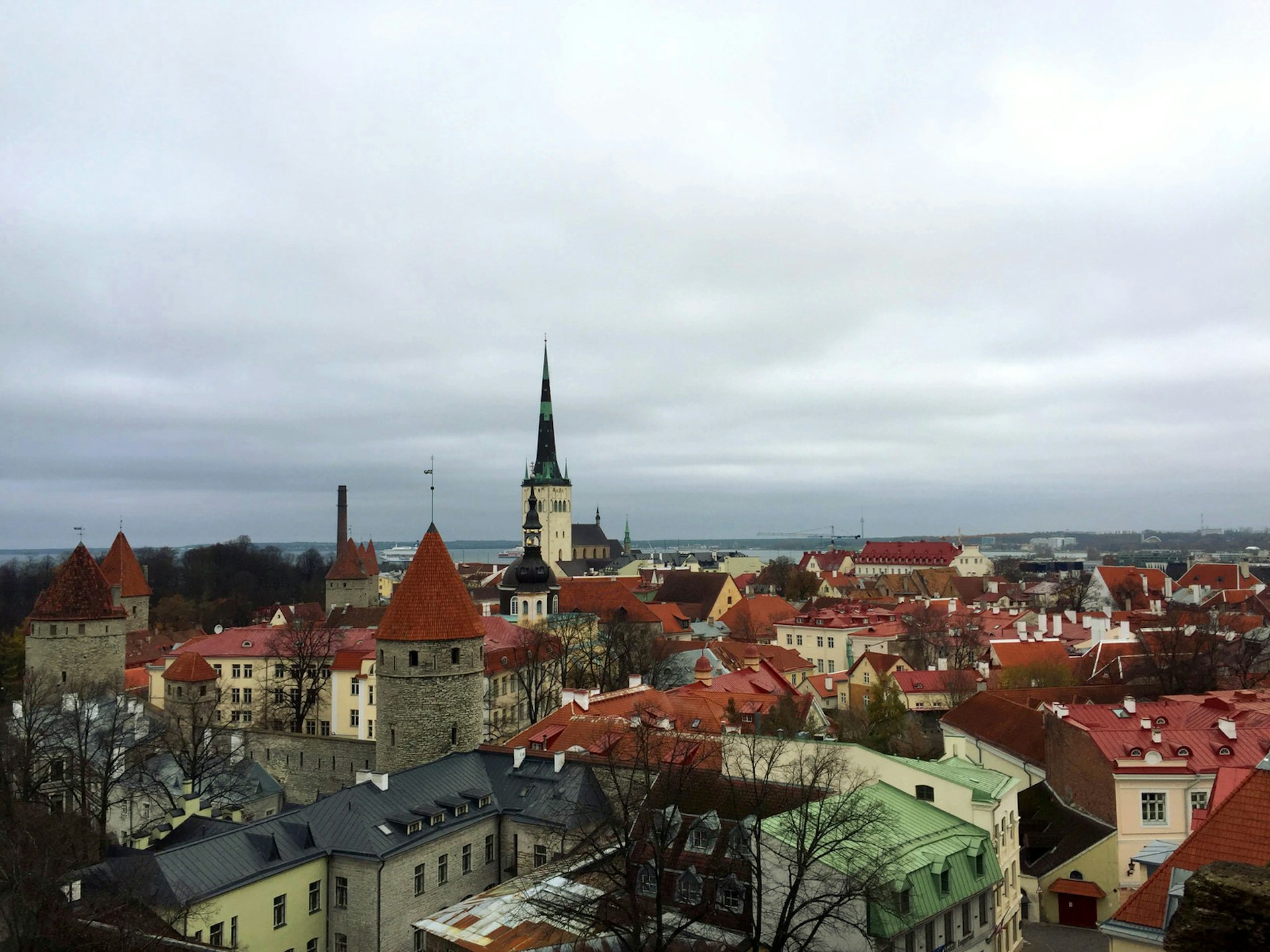 View of spires and red-tiled rooftops of old town Tallinn