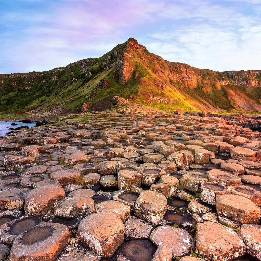 A view of the Giant's Causeway's rock formations at sunset.