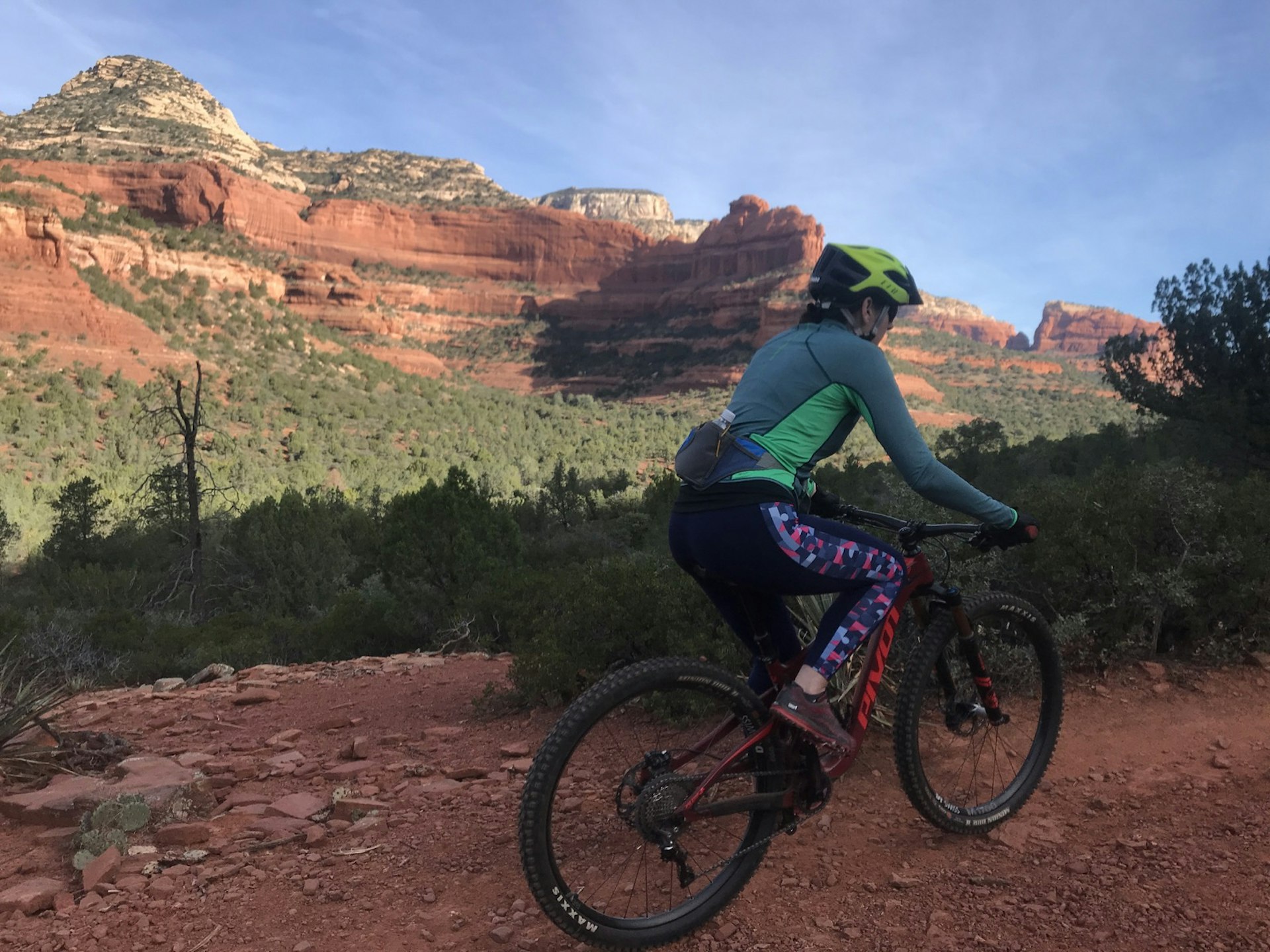 A woman mountain bikes along a trail in Sedona