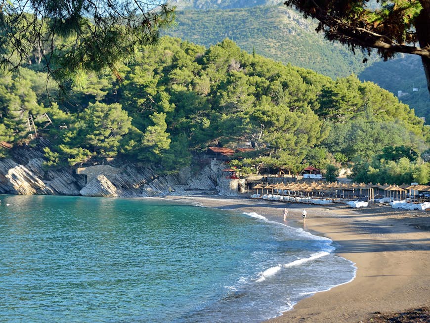 The charming Lučice Beach in Petrovac is set against a green backdrop © Artist2015 / Shutterstock