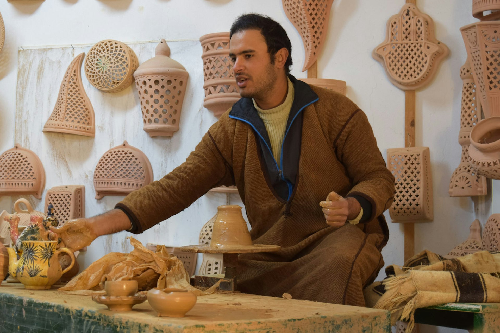 Berber potter who is a master of ceramic cookware shows off his works in Guellala, Djerba, Tunisia