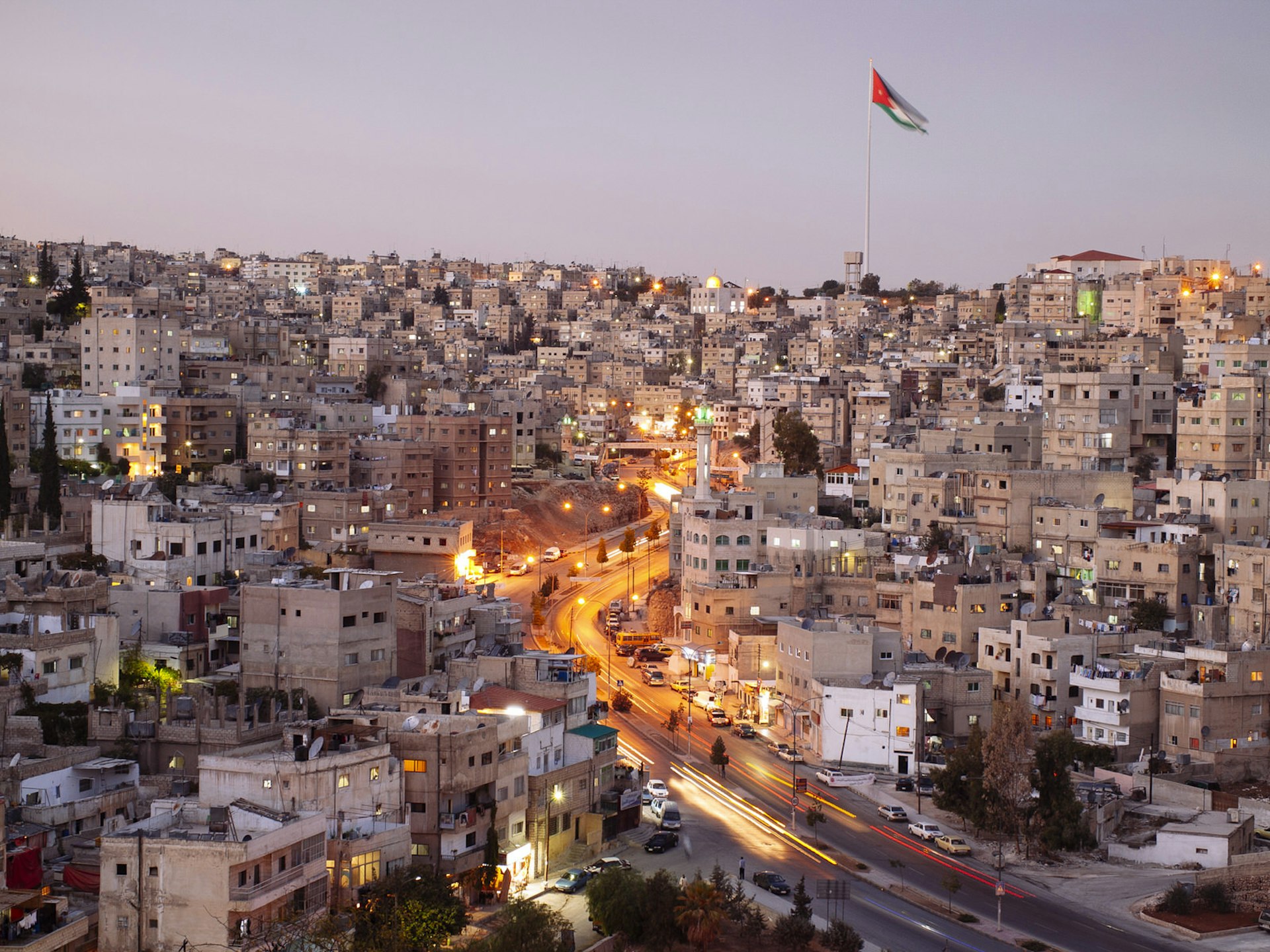 Street in Amman, Jordan, with giant flagpole