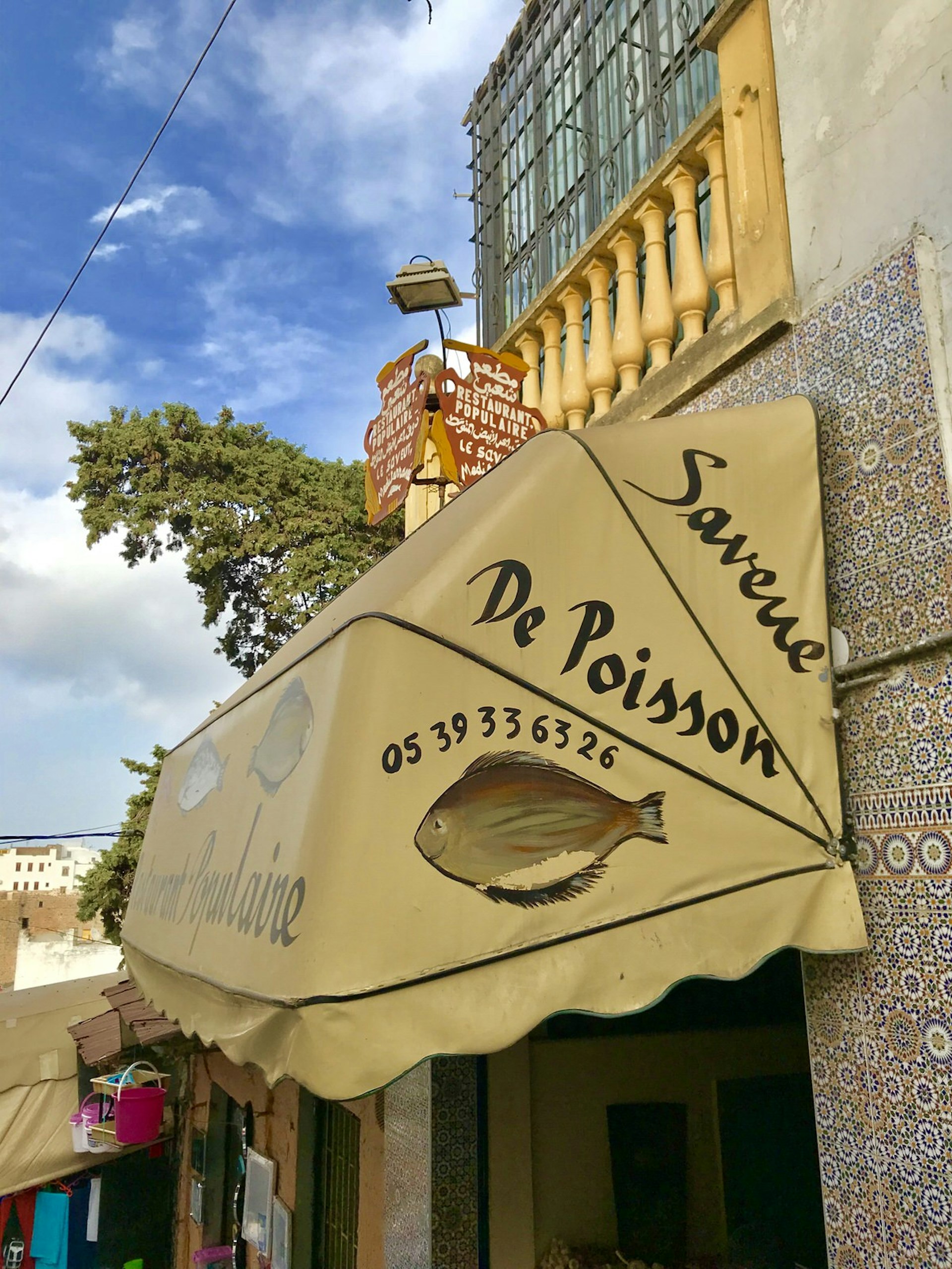 Exterior signage of Saveur de Poisson, Tangier, Morocco
