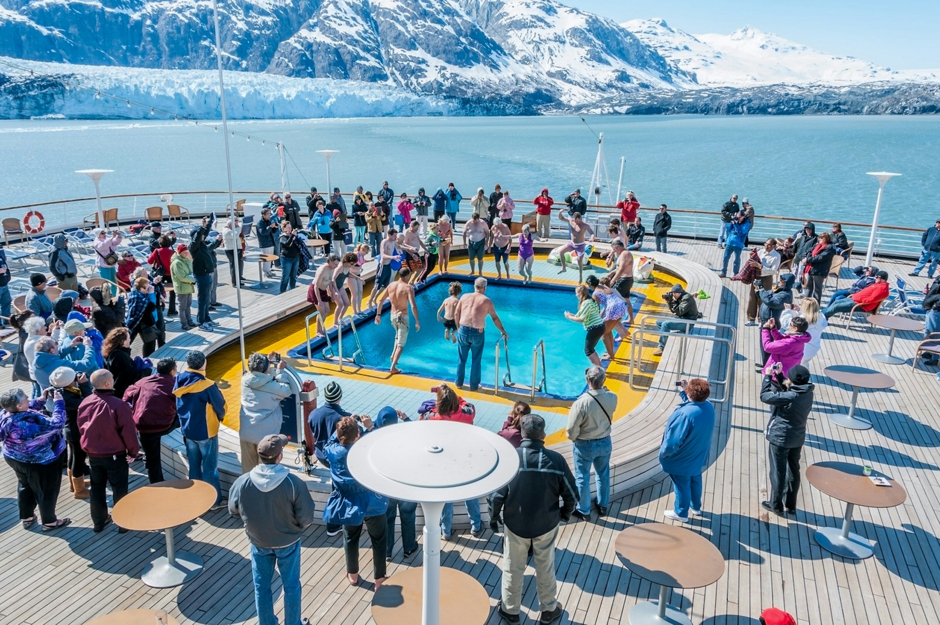 Cruise ship passengers in Glacier Bay National Park take the Polar Bear Dip, into the aft deck pool.