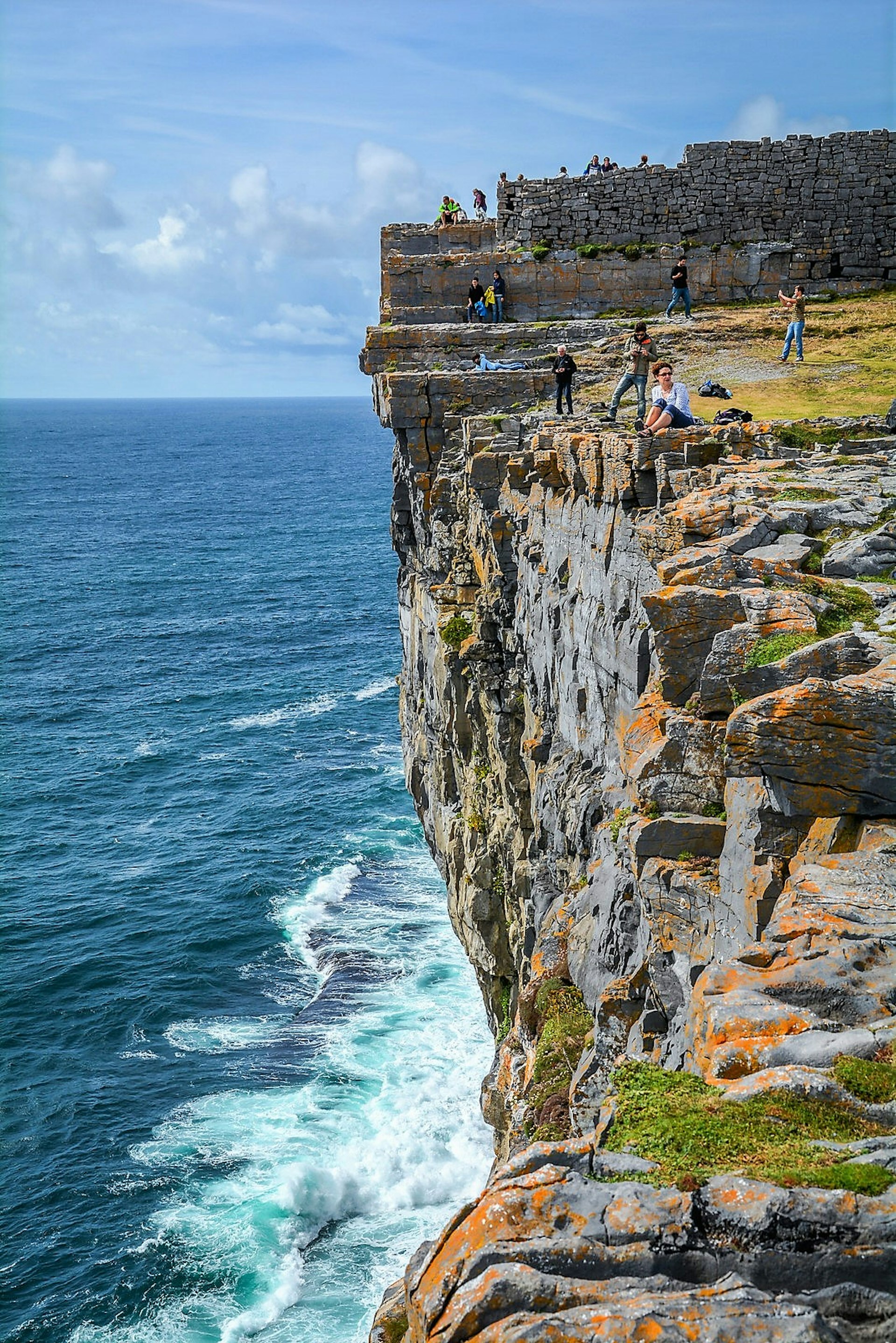 Dramatic cliffs and the prehistoric ruins of Dun Aengus, Ireland.