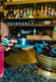 A bartender adds a few drops of active carbon to a drink at El Bebedoro in San Jose, Costa Rica. The restaurant scene is thriving in the country's capital city.