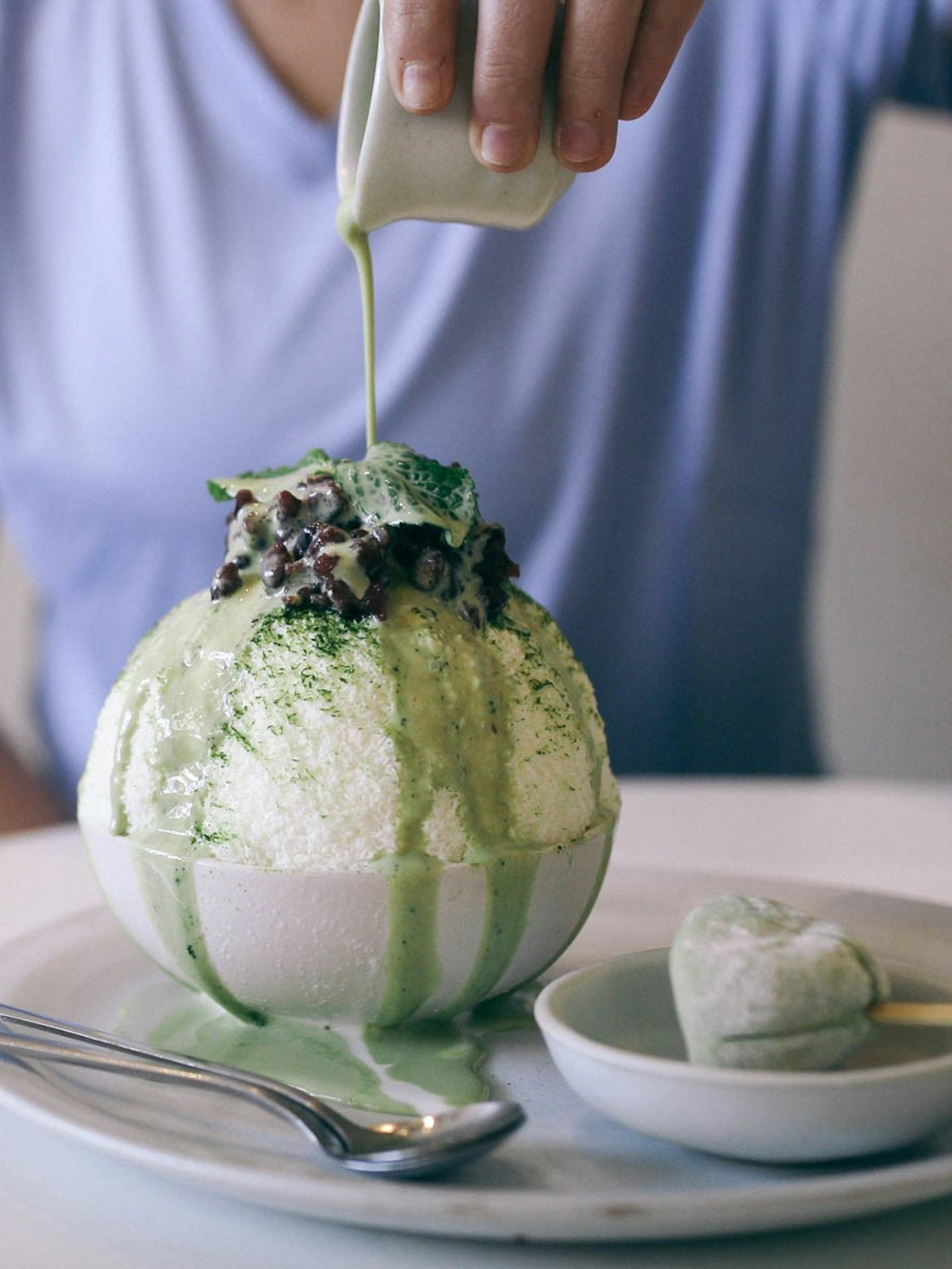 A bowl of bingsu (milky shaved ice topped with sweet treats) at Cheevit Cheeva cafe