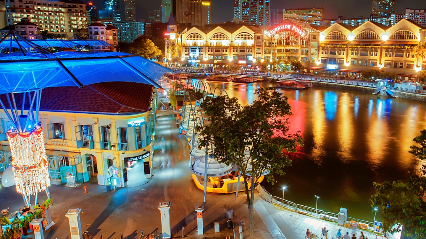 Singapore's colourful Clarke Quay is buzzing as night falls © wsboon images / Getty Images