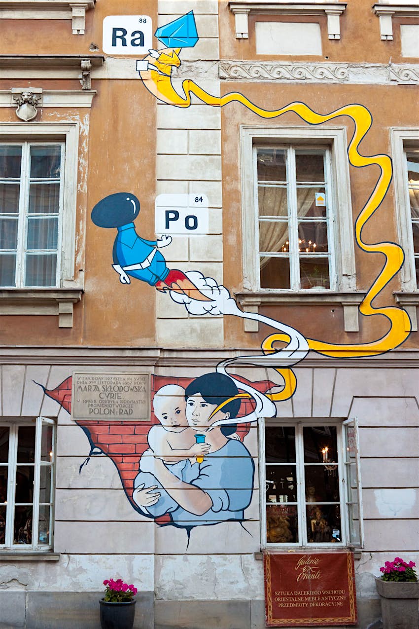 Street art on the facade of a building marking the birthplace of Marie Sklodowska-Curie in Warsaw, Poland
