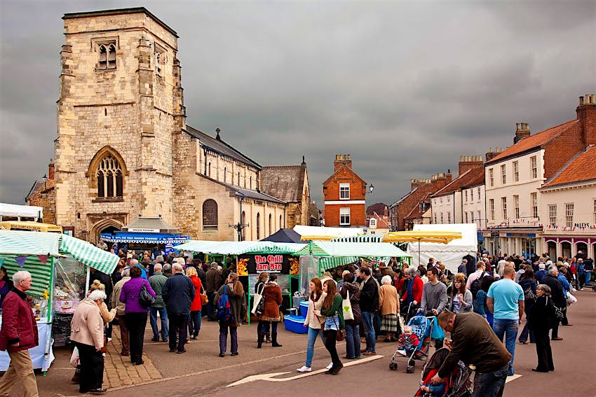 People wander around the busy food stalls in Malton town centre.