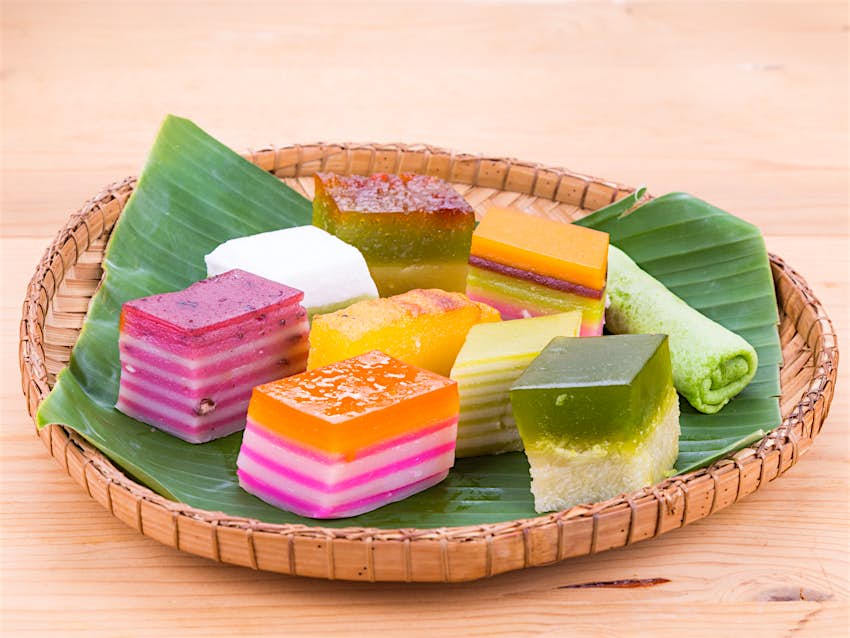 Assorted brightly coloured Peranakan rice cakes known as kueh