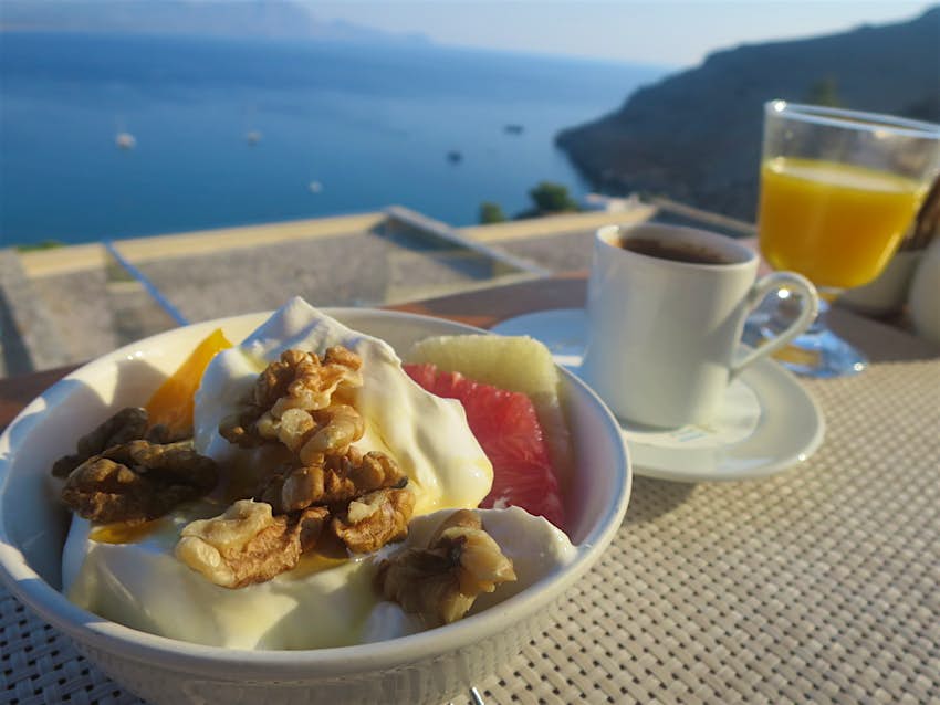 Greek yoghurt, walnuts, honey and fruit served for breakfast on Rhodes island