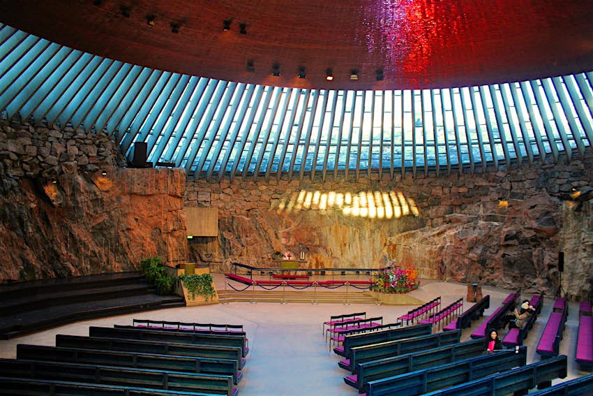 Visitors pausing for reflection inside Temppeliauko (the Rock Church), Helsinki