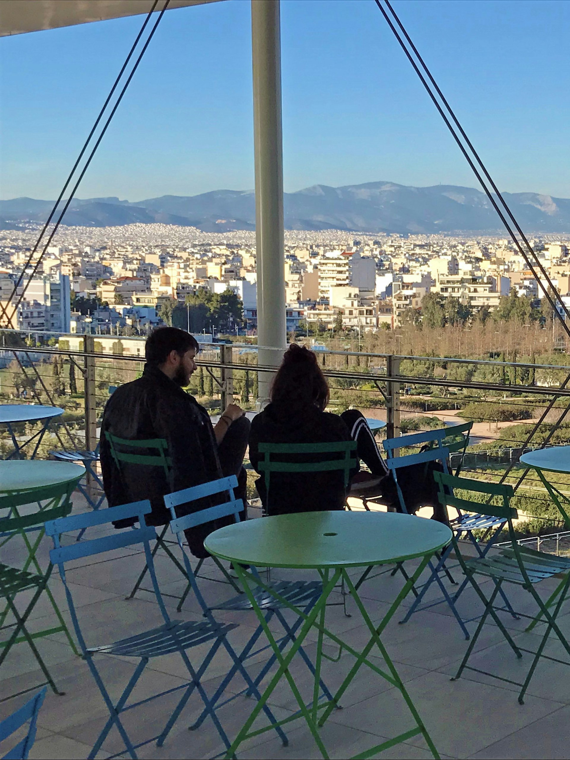 A couple on a cafe terrace at the Stavros Niarchos Foundation Cultural Center