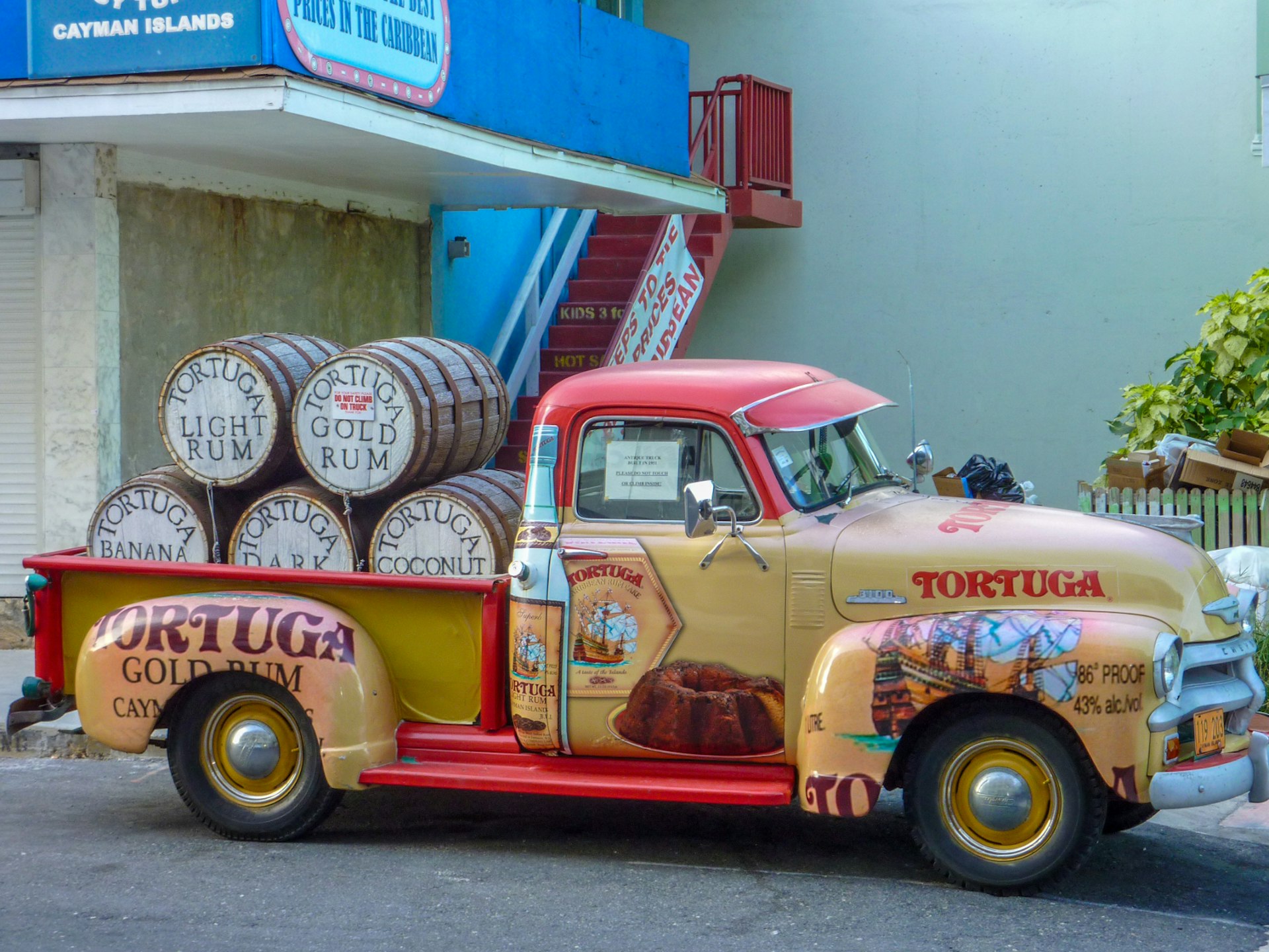 Antique Chevy truck loaded with Tortuga Gold Rum on Grand Cayman © Meandering Trail Media / Shutterstock