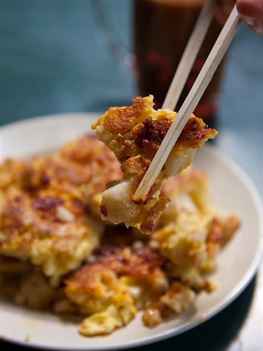 A plate of fried carrot cake, a popular dish in Singapore