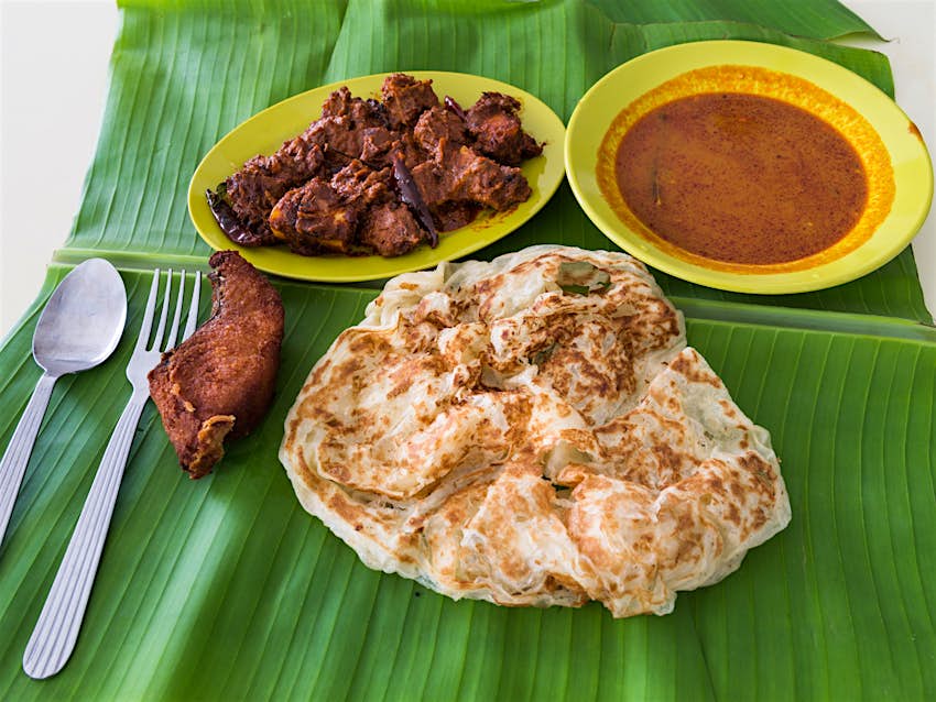 Roti prata, or South Indian flatbreads, served with a spicy curry sauce
