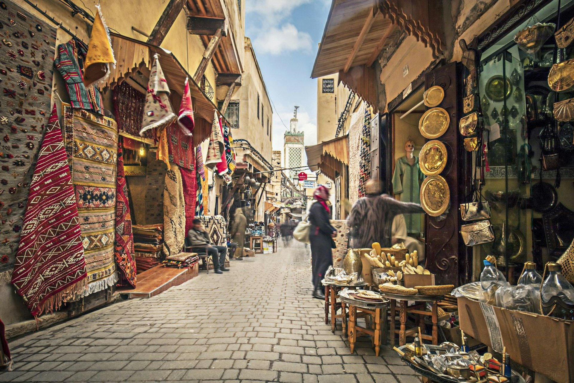 Stores selling their colourful wares in the medina streets of Fez, Morocco