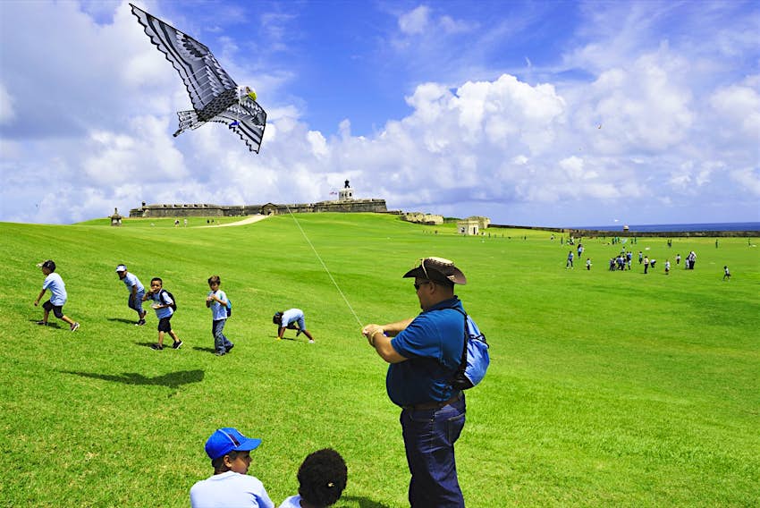 A group of children play on the grounds of Castillo San Felipe del Morro, a 16th-century fortress located in San Juan, Puerto Rico © T Photography / Shutterstock 
