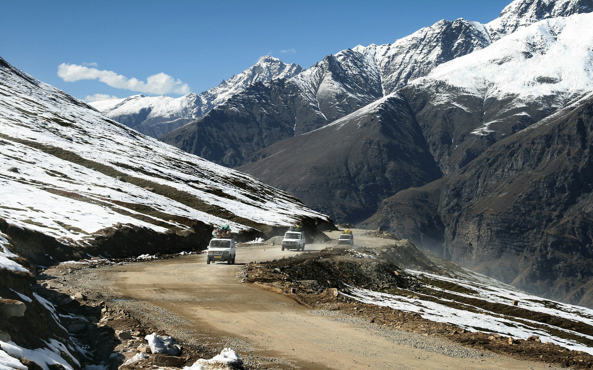 Jeeps passing through a desolate landscape in Himachal Pradesh
