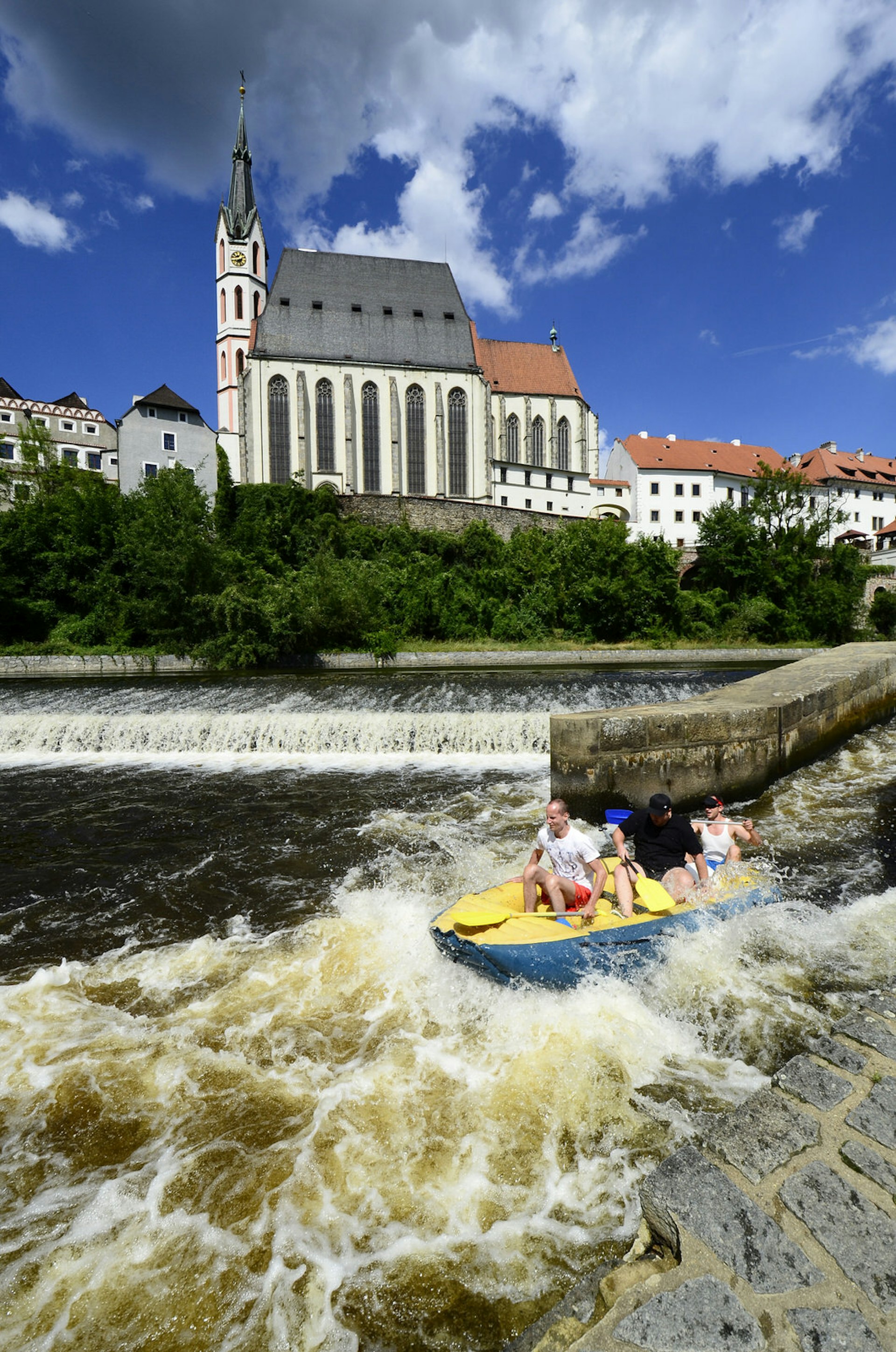 A group of people rafting the Vlatava River near Český Krumlov, Czech Republic 
