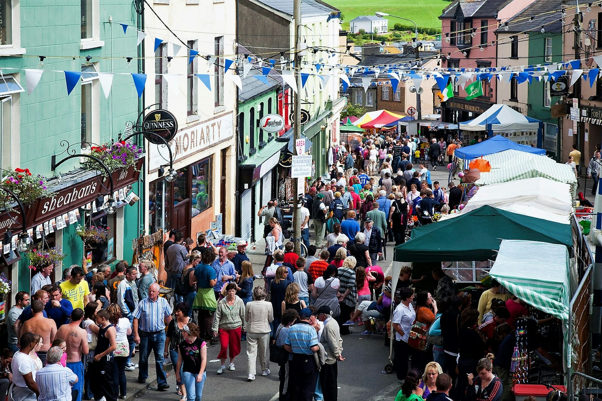 People stroll through the streets of Killorglin during the annual Puck Fair
