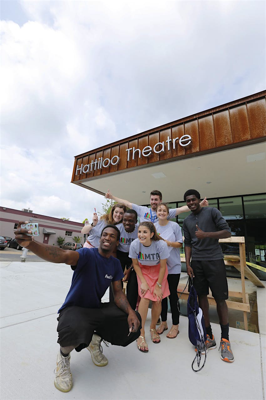 Group takes photo in front of modern-looking Hattiloo Theatre © Justin Fox Burks / Memphis Convention & Visitors Bureau 