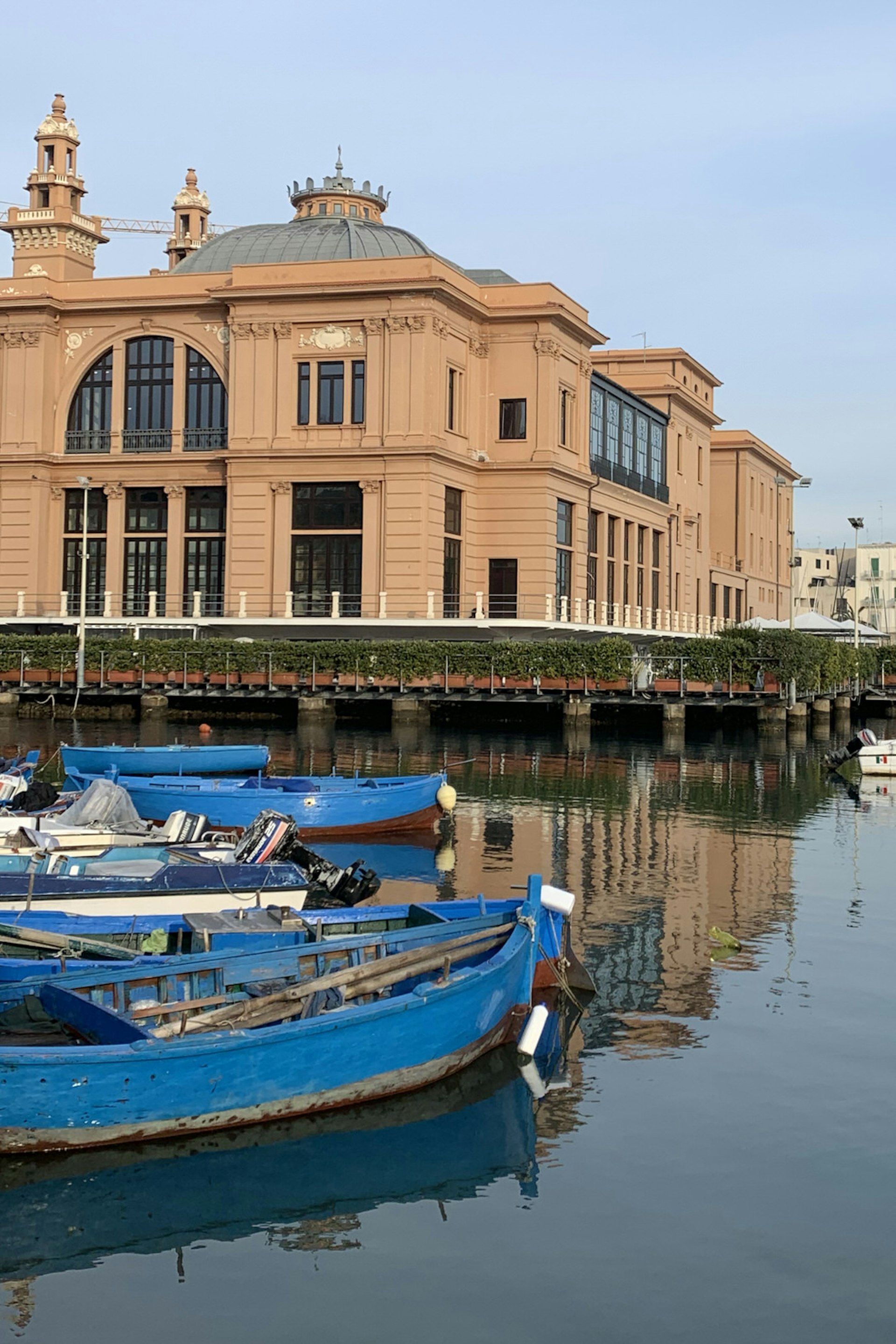 The peach coloured Art Nouveau Teatro Margherita sits right on the harbour