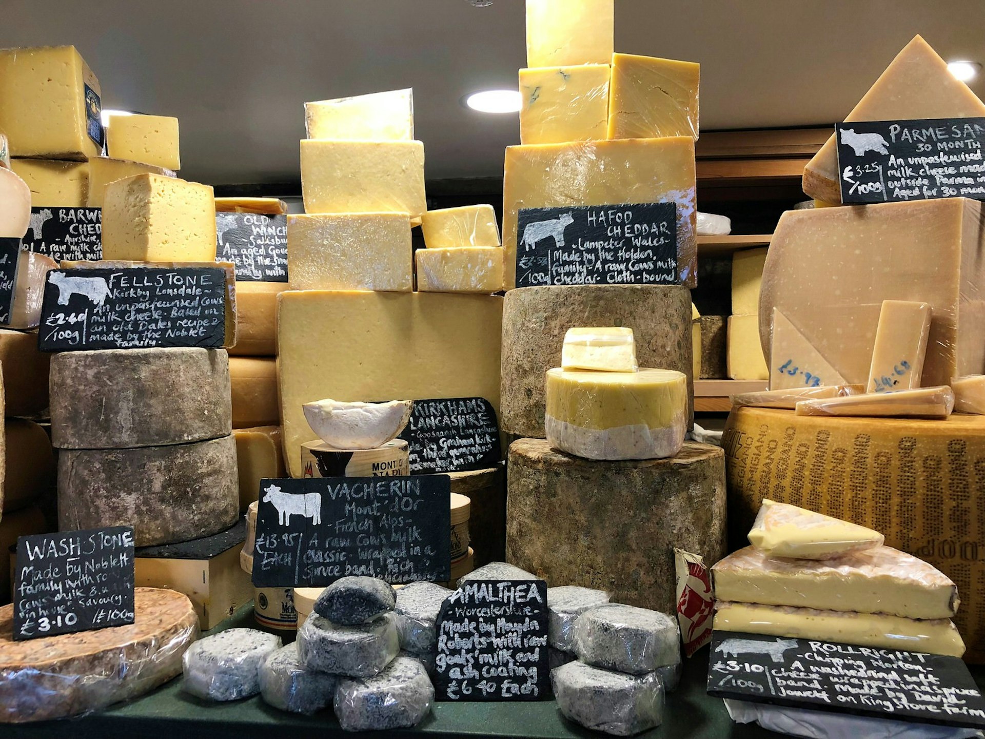 Cheese of all shapes and sizes on display in the Courtyard Dairy, North Yorkshire.