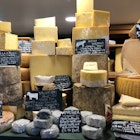 Cheese of all shapes and size on display in the Courtyard Dairy, North Yorkshire.