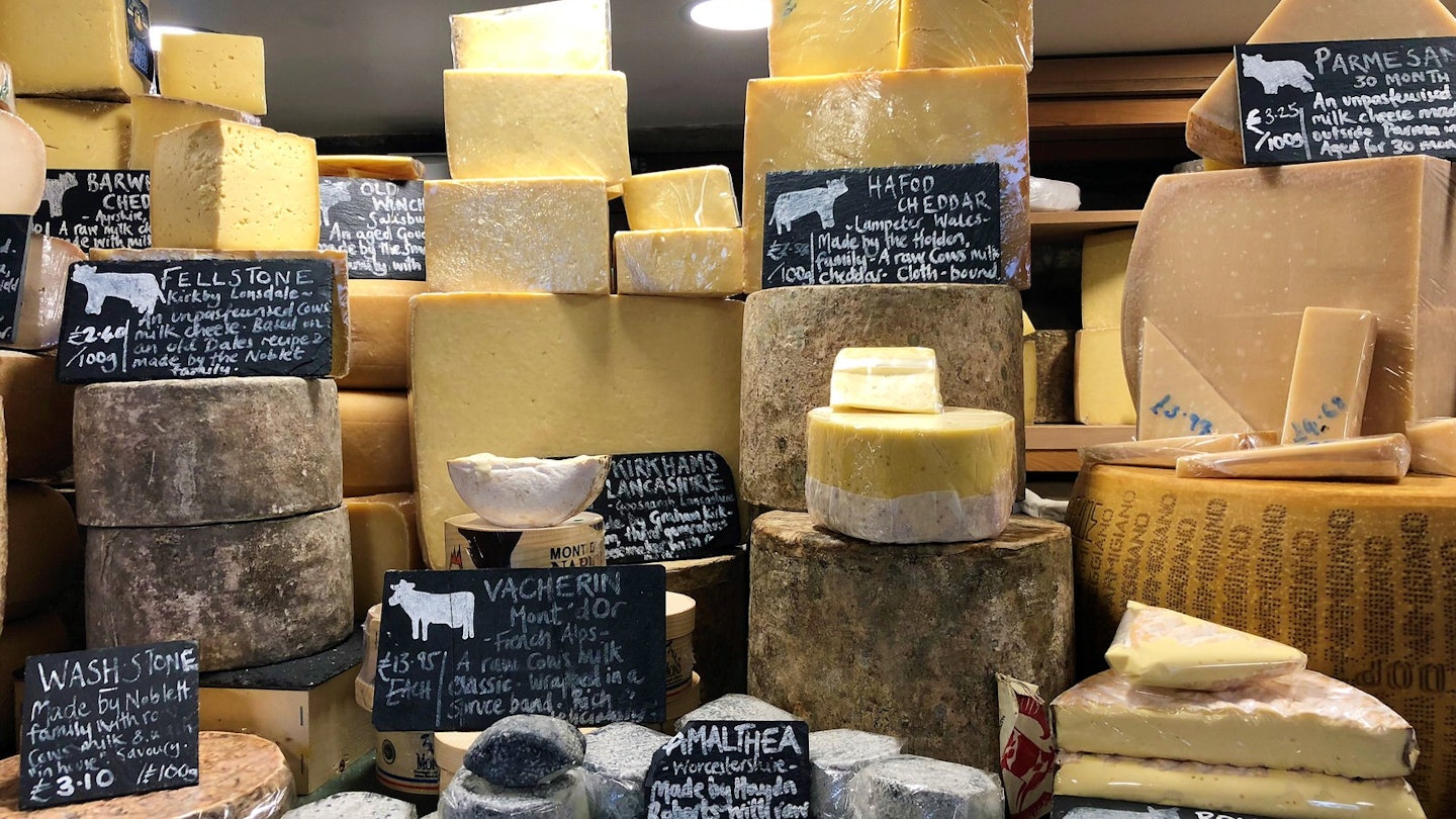 Cheese of all shapes and size on display in the Courtyard Dairy, North Yorkshire.