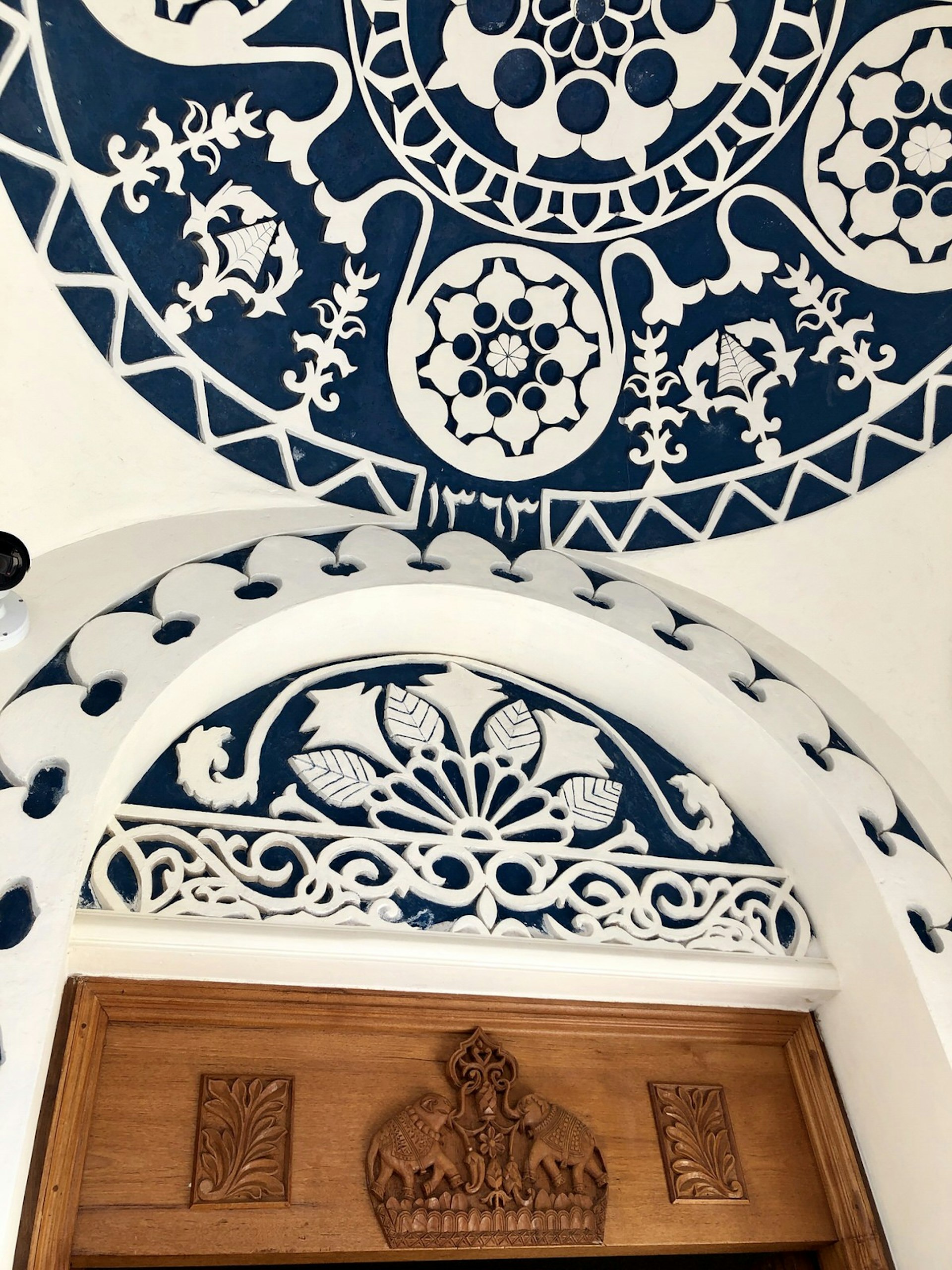 Traditional Indian and Middle Eastern designs and architecture above a door at Al Bait, Sharjah, United Arab Emirates