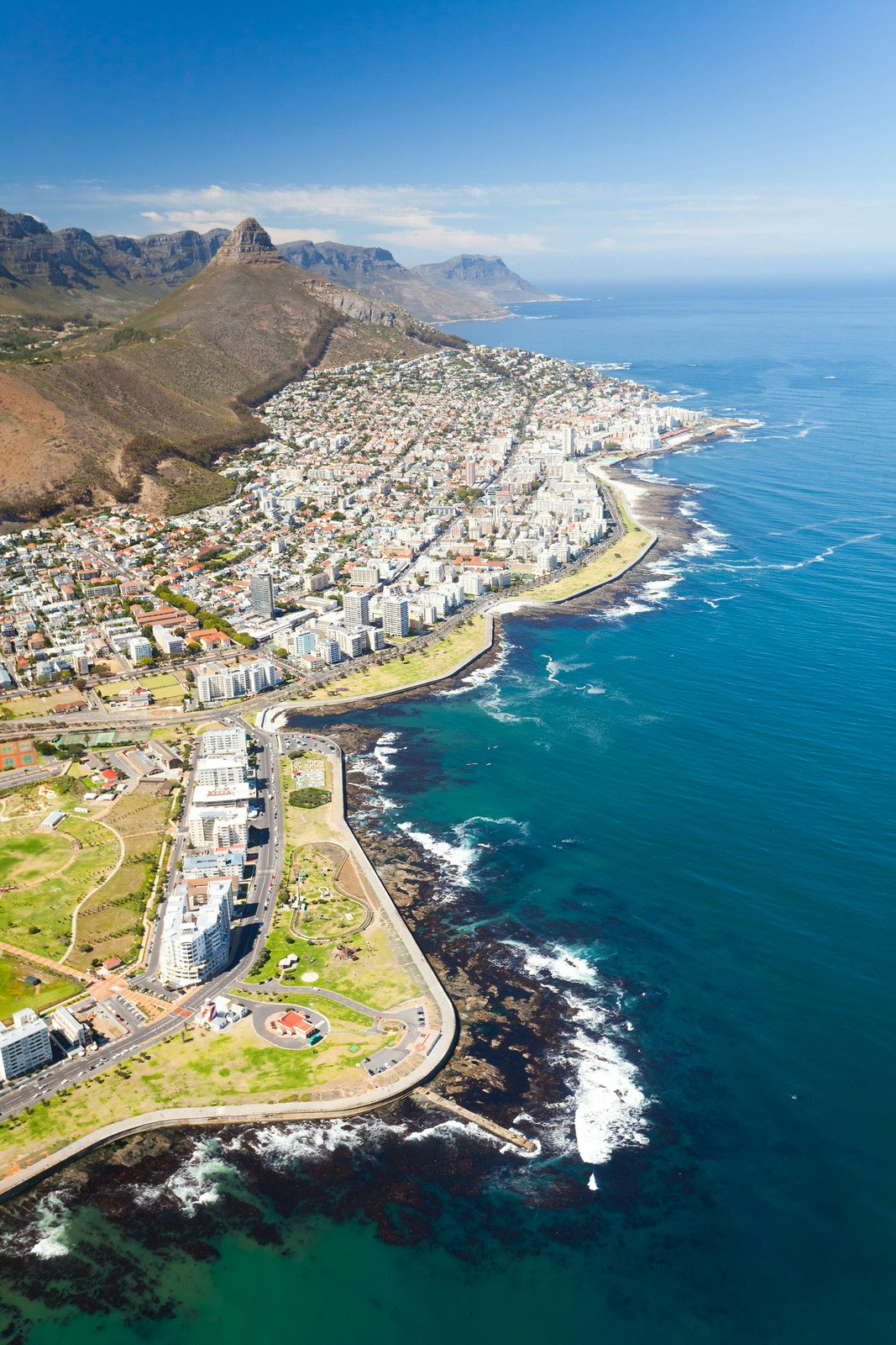 The paved promenade, backed by lawns and high-rise apartment blocks, meanders along the rocky shore of Sea Point © michaeljung / Shutterstock