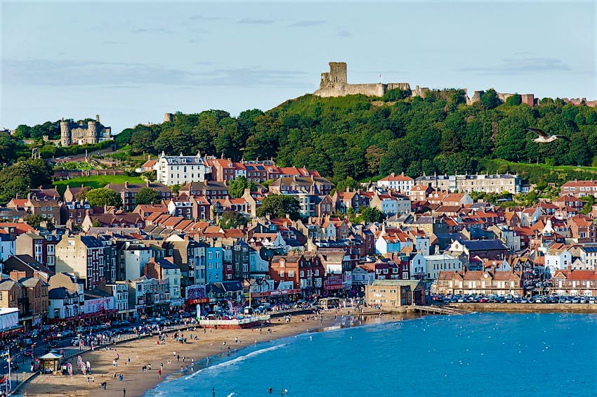 View of Scarborough beach with the town's castle on the hill above it