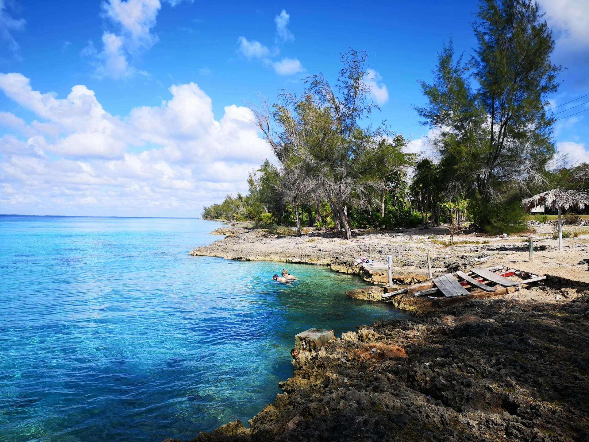 A couple swims in the Bay of Pigs in Cuba 