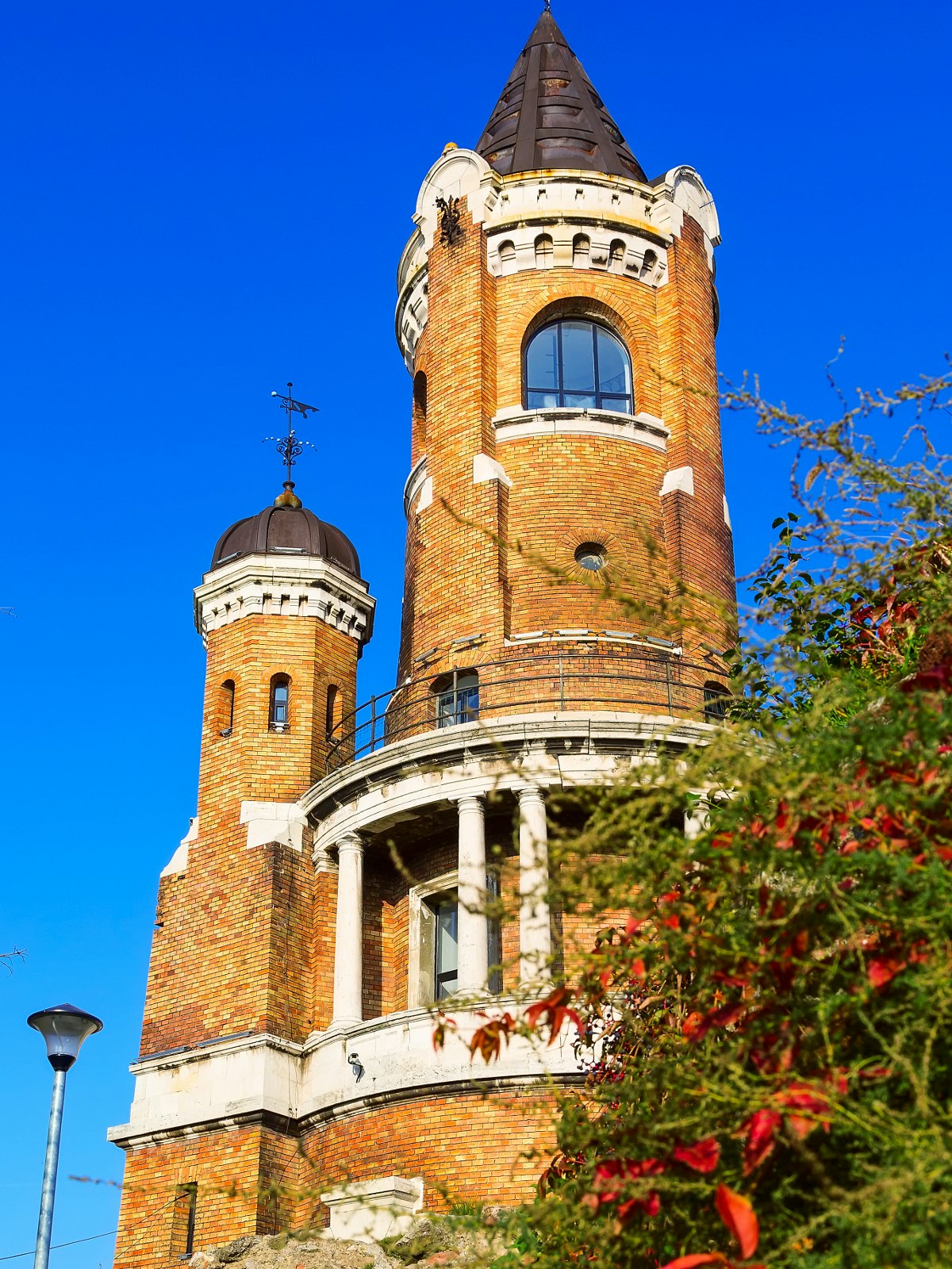 The tall, round, red-brick and white-stone Gardoš tower in Zemun neighbourhood