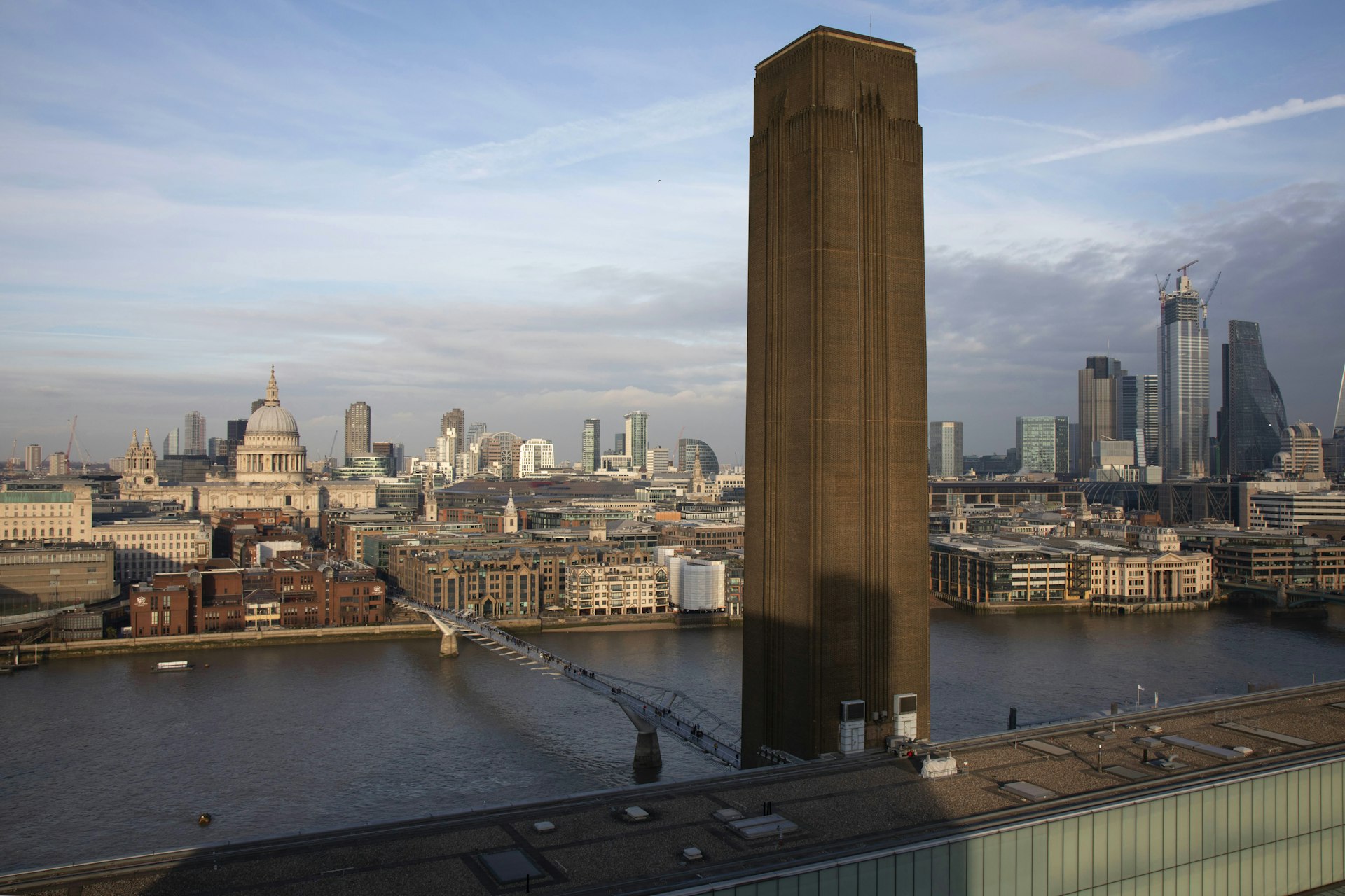 View of the Tate Modern tower with the City of London behind it, as seen from the viewing balcony of Tate Modern