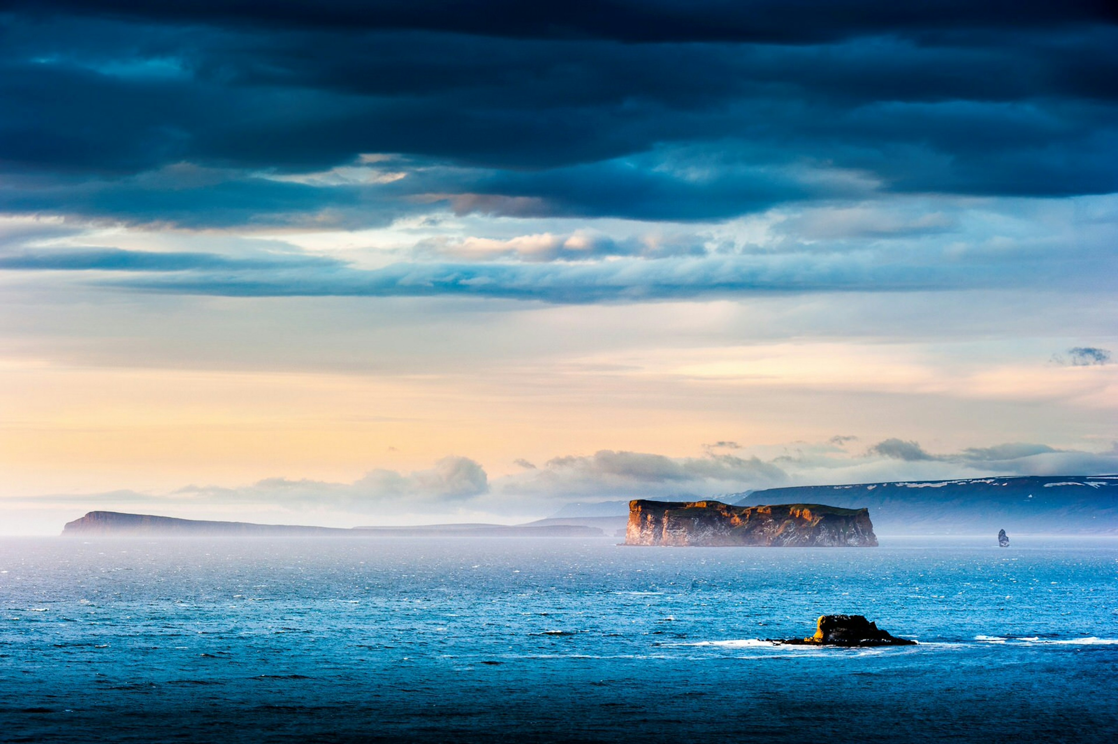 The remote island of Drangey sits in a dramatic landscape