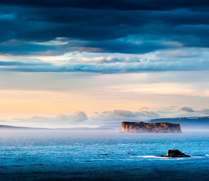 The remote island of Drangey sits in a dramatic landscape