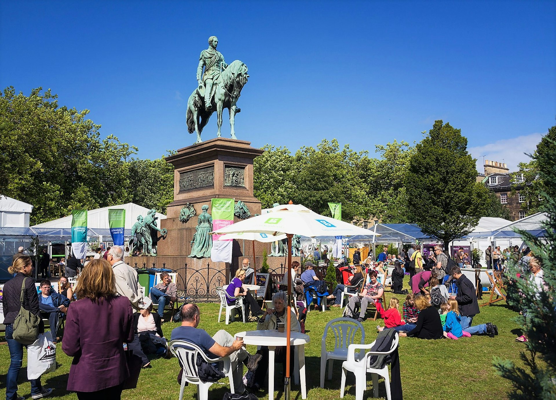 People relax in Charlotte Square dutring the Edinburgh Book Festival