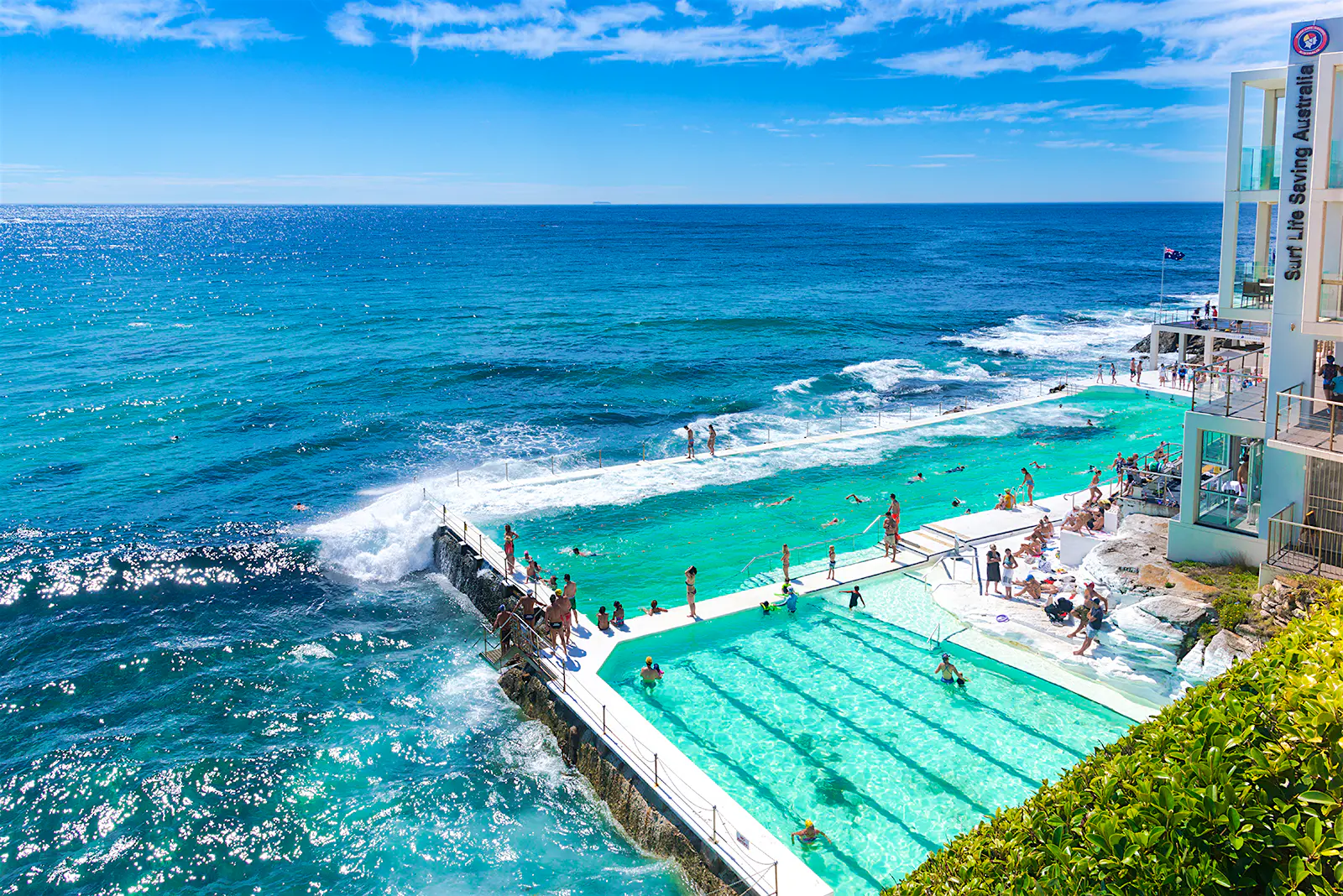 Features - Tourist swimmers are swimming in the Icebergs pool, Bondi beach. Sydney's famous Bondi Icebergs Pool