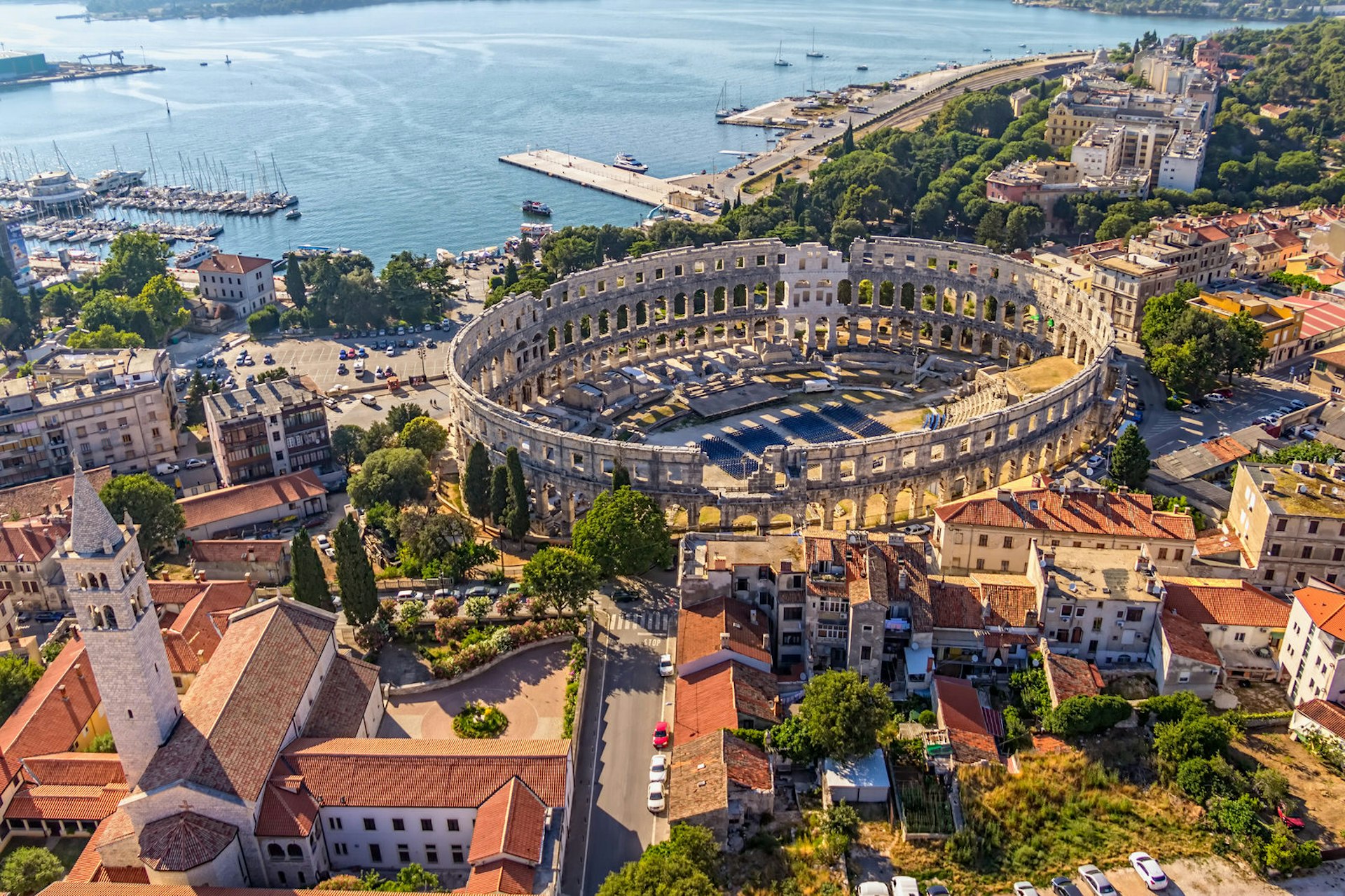 An aerial view of Pula's remarkably intact Roman Amphitheatre, beside the sea
