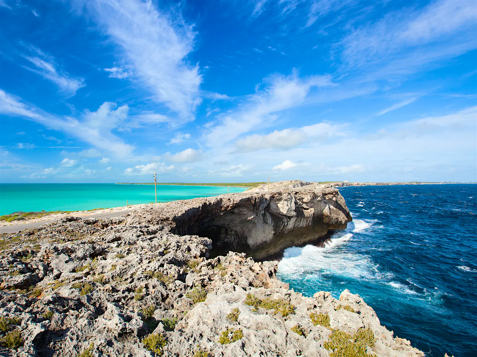 Features - Glass_window_bridge_Bahamas-a16a0716540d The turquoise Caribbean Sea meets the royal-blue Atlantic at the Glass Window Bridge, Eleuthera