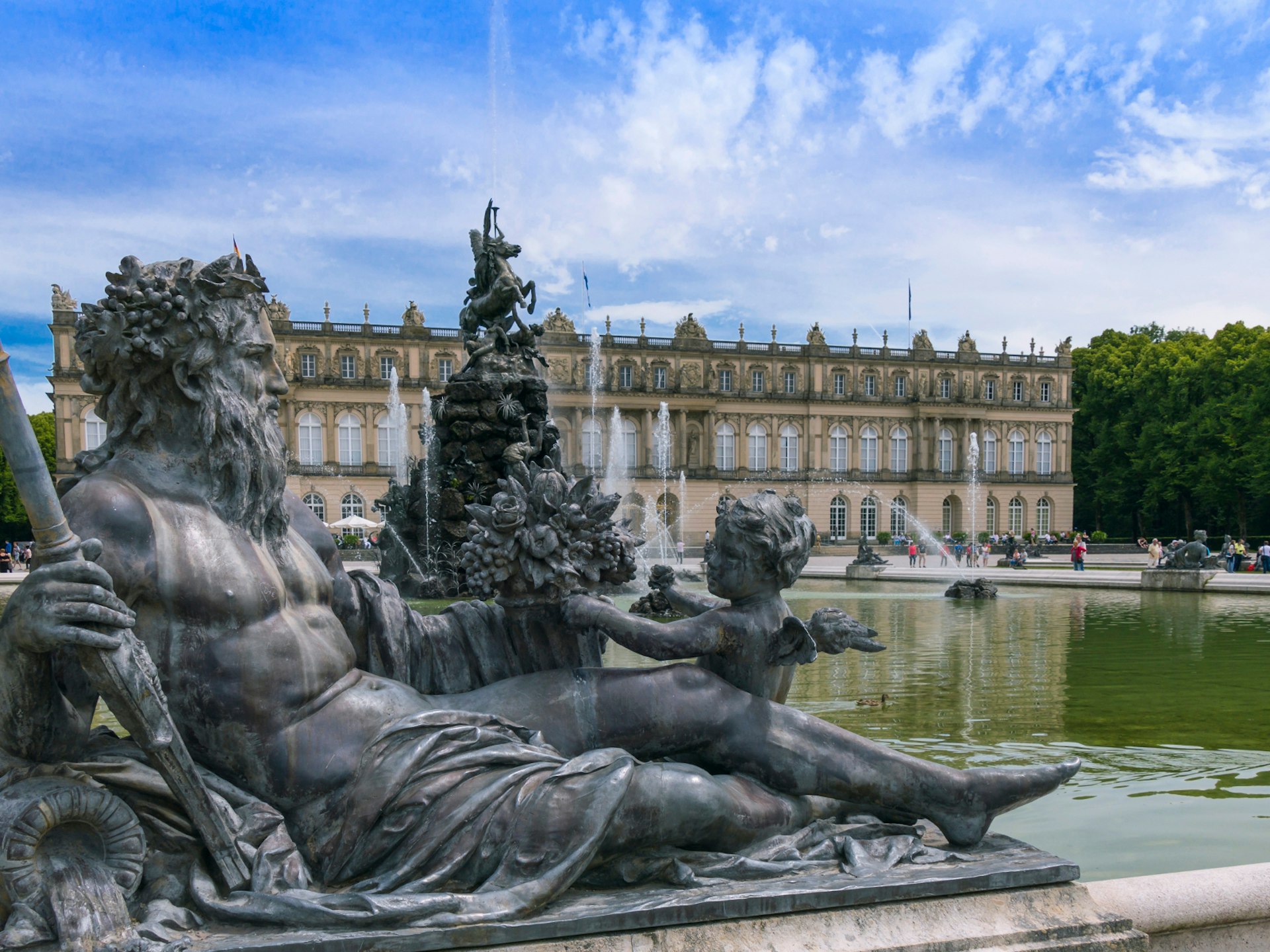 The Versailles-inspired Herrenchiemsee palace on Herreninsel Island, with a statue in the foreground