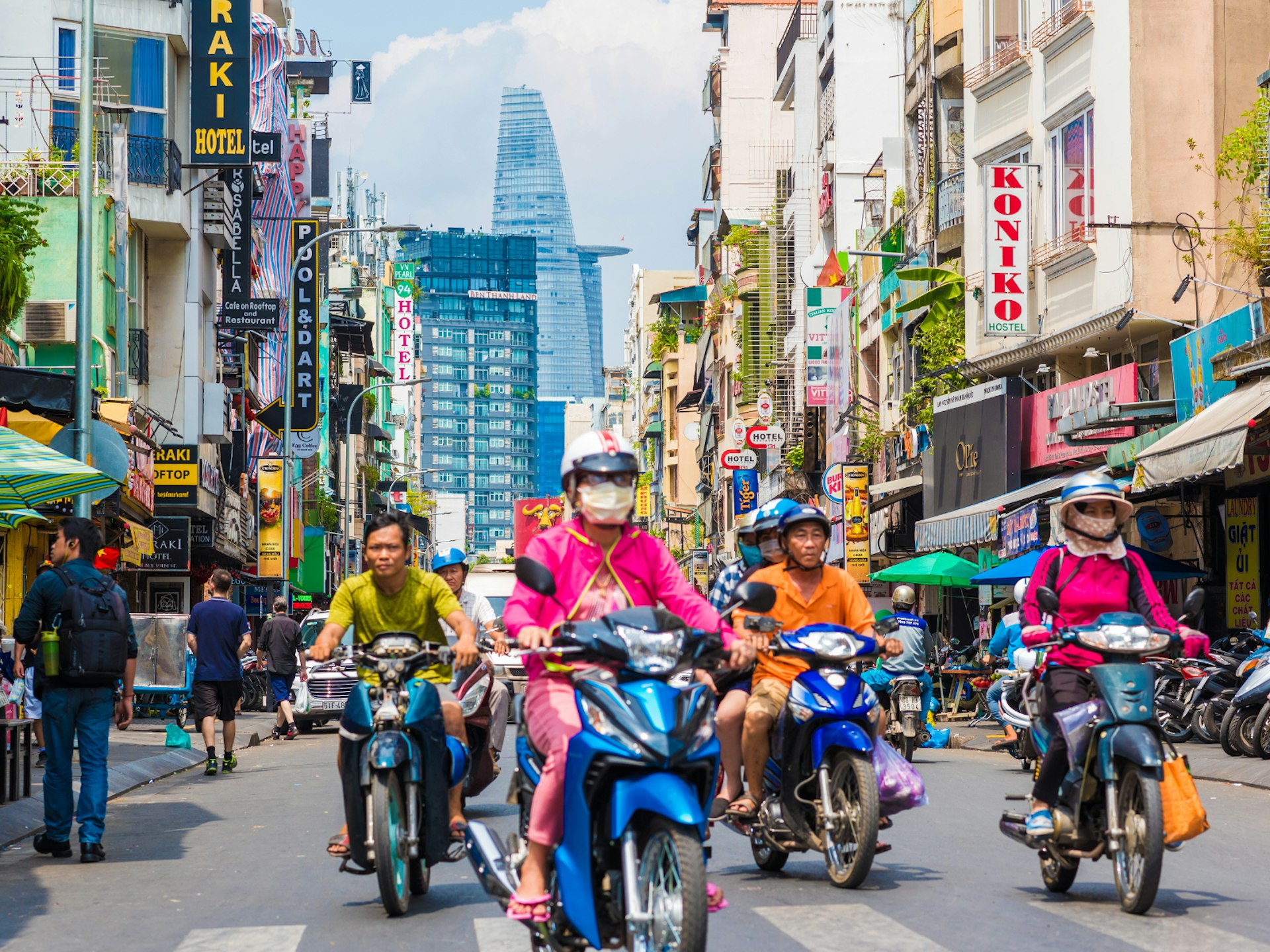 Moped users riding down the streets of Hi Chi Minh City, Vietnam